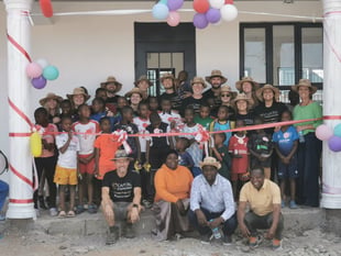 Staff make final visit to orphanage secured through firm's fundraising