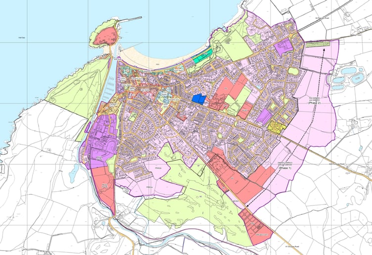 Areas marked in light pink show land proposed to be zoned for housing