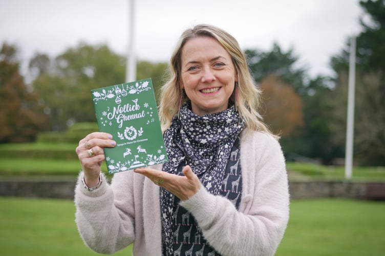 Dr Chloë Woolley, Manx music development officer with the book, 'Nollick Ghennal – Songs in Manx for Christmas'