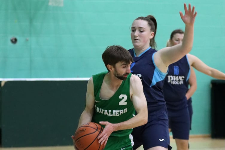 Zoe Kirkham piles on pressure defence against Andy Cregeen in a close Hoops v Cavaliers matchup in the opening week of the Senior League at the NSC on Thursday evening (Photo: Dave Norton)