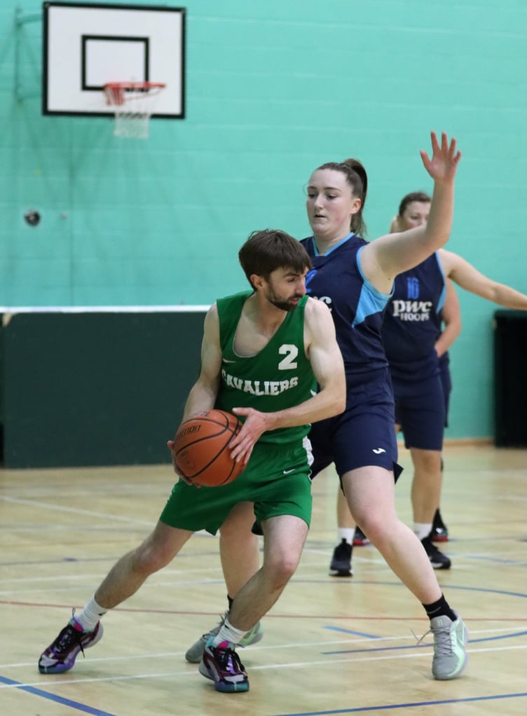 Zoe Kirkham piles on pressure defence against Andy Cregeen in a close Hoops v Cavaliers matchup in the opening week of the Senior League at the NSC on Thursday evening (Photo: Dave Norton)
