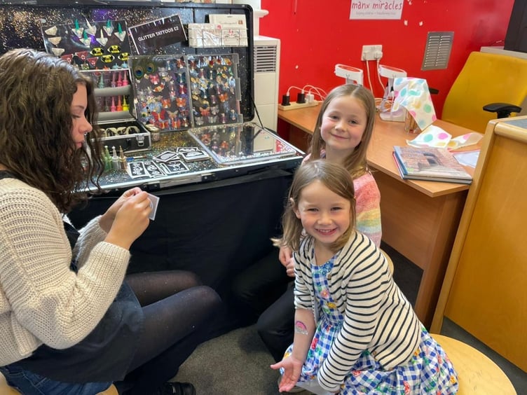 All smiles for the glitter tattoos