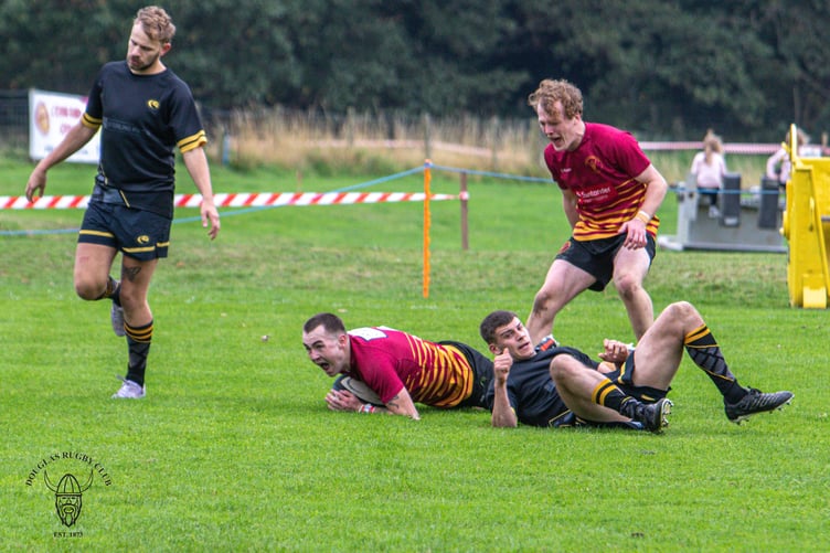 Nathan Robson celebrates his 78th-minute try for Douglas against Northwich at Port-e-Chee on Saturday (Photo: Richard Ebbutt)