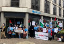 Protest held outside island bank branch over alleged financial links to arms firms