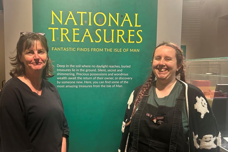 Allison Fox, curator for archaeology at Manx National Heritage and Sophie Crump, assistant collections manager at the British Museum installing the exhibition
