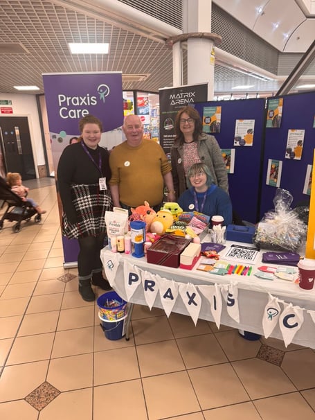 Rebecca Moore, Eric Wade, Nicolette Powell and Dakota Summer manning the Praxis Care stall in the Strand Centre