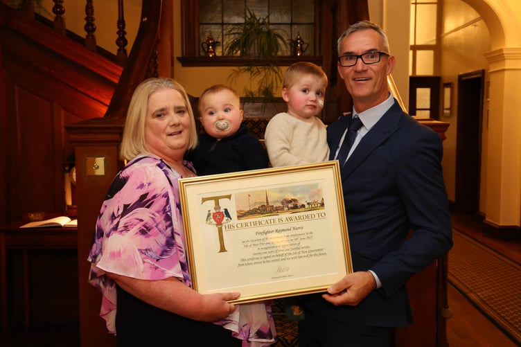 Firefighter Raymond Harris with his family