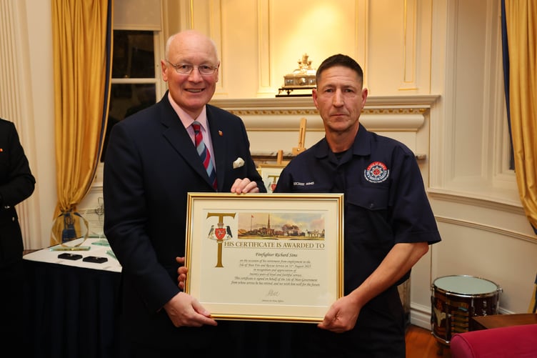 Firefighter Richard Sims with the Lieutenant Governor