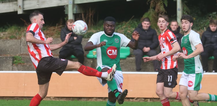 Peel's Matthew Woods (left) and Laxey's Eddie Kangah compete for the ball during Saturday's Canada Life Premier League contest at Glen Road. Despite Kangah finding the back of the net, it was the westerners who triumphed 4-5 (Photo: Paul Hatton)