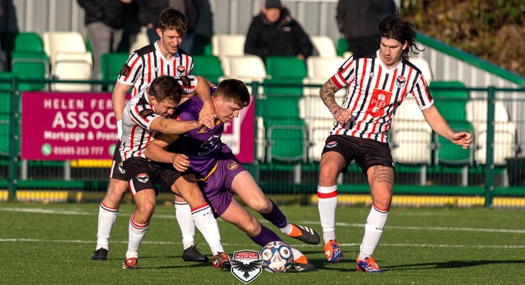 FC Isle of Man midfielder Sammy Gelling gets to grips with a  City of Liverpool opponent during Saturday's Premier Division clash in Merseyside. The Ravens returned home with all three points thanks to a 2-1 victory (Photo: Hannah McHugh)