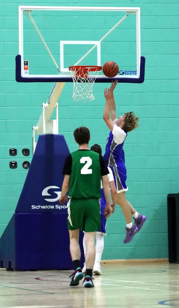 Wolves rookie Seb Smith hits a fast break lay-up in his side's their match-up against Cavaliers in the Senior League last Thursday evening (Photo: Oliver Hamilton)