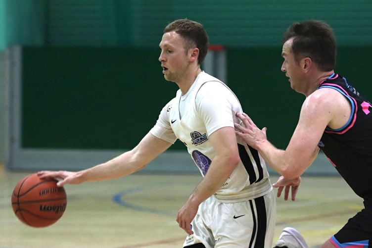 Jets' Tom Dalton-Brown dribbles down the court as Pirates' Nick Hamer chases on defence to cover during the two sides' clash at the NSC (Photo: Shane Collins)