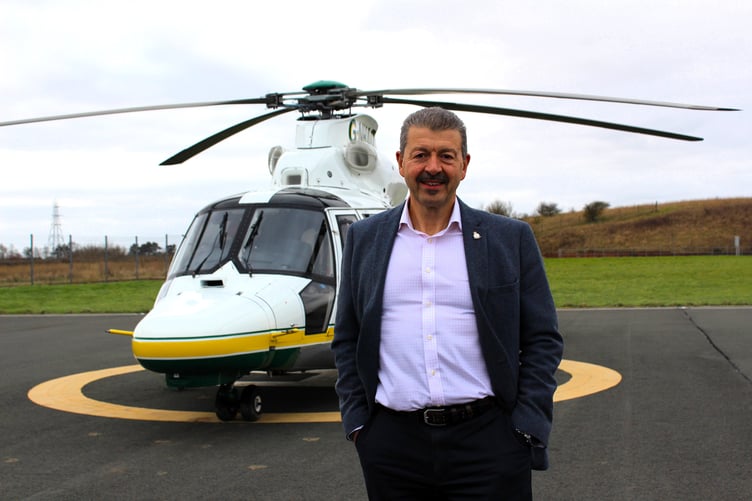 GNAAS CEO Joe Garcia in front of one of the charity's helicopters