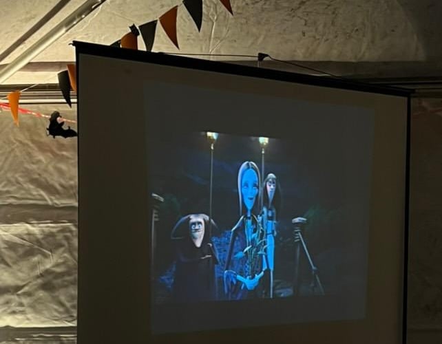A projector was set up showing spooky movies in the kids zone.