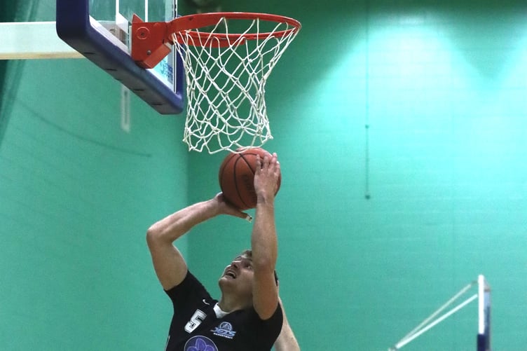 Jake Glover takes off on the power lay-up for Jets as Phoenix players Matt Jones and Sonny Hewitt attempt to defend (Photo: Oliver Hamilton)