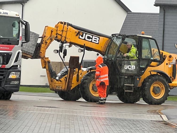 Pallets of paving blocks are unloaded at The Meadows