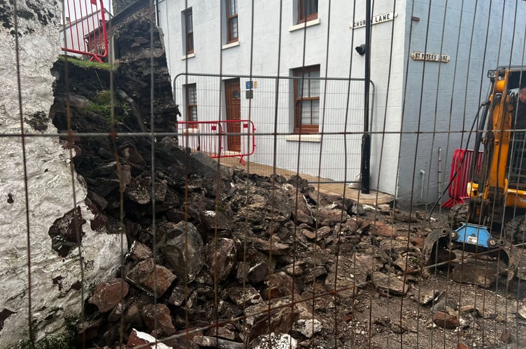 The clear-up operation on the Church Lane wall was underway on Thursday morning 