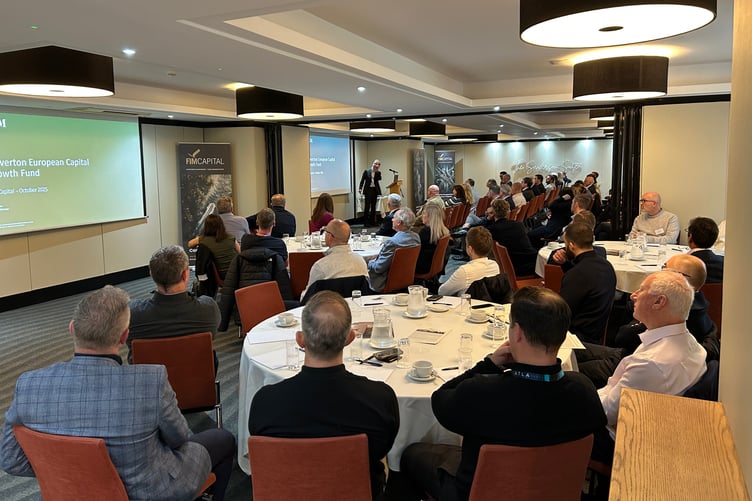 Chris Garsten addresses audience at FIM Capital event