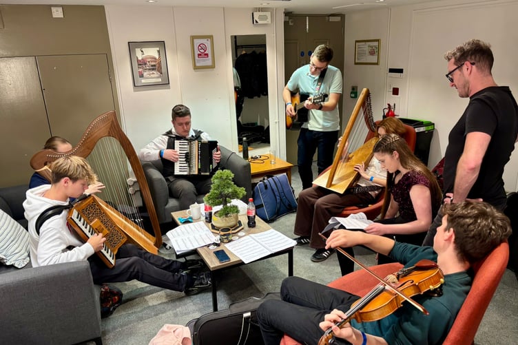 Relaxing and jamming in their dressing room before the show