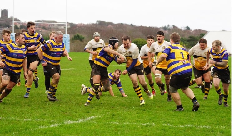 Vagabonds' Dan Bonwick on the charge against Dukinfield at Ballafletcher on Saturday (Photo: John Liver/Mumbles Pics)