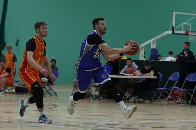 Viktor Capkanovski goes on the fast break layup for Wolves as Matt Jones chases down for Southern Phoenix (Photo: Martin Dunne)