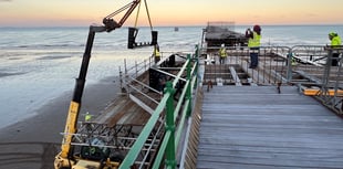 Watch as volunteers race against time and tide to help restore pier
