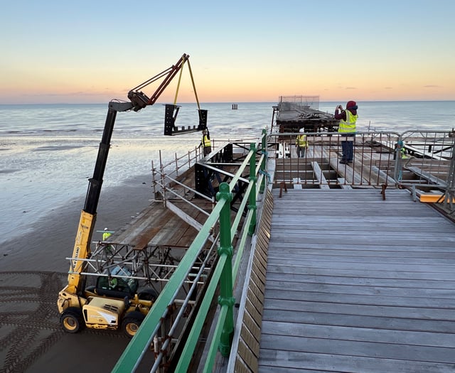 Watch as volunteers race against time and tide to help restore pier