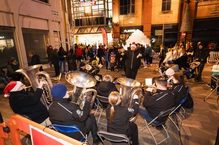 A brass band entertains visitors to the Douglas Christmas lights switch on 2025