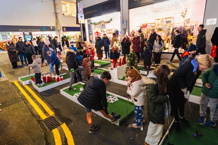 Youngsters enjoy the festive crazy golf at the Douglas Christmas lights switch on 2025