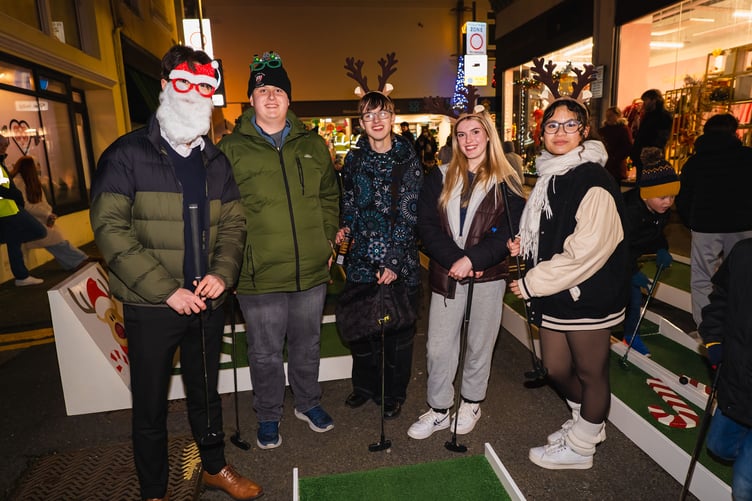 Visitors to the Douglas lights switch on enjoying the festive crazy golf
