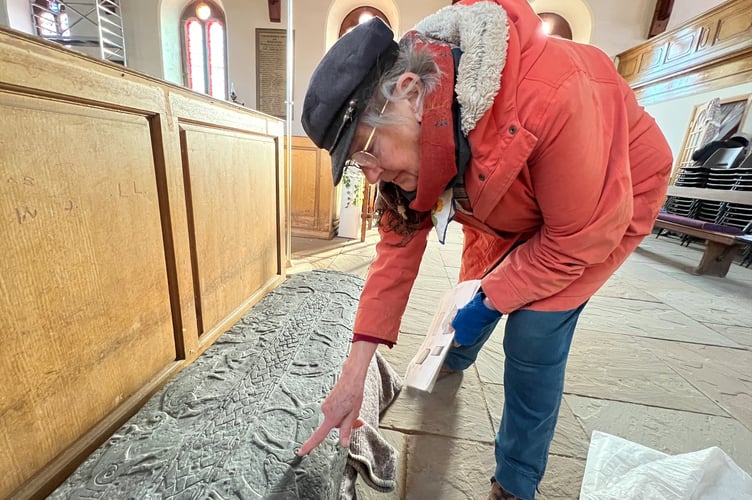 Andreas church volunteer Waveney Jenkins with safely-extracted Sandulf's cross