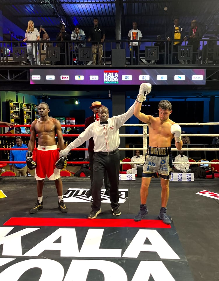 Jamie Devine's arm is raised by the referee after beating Christopher Osicho at the Nightmare in Nairobi event in Kenya last Friday