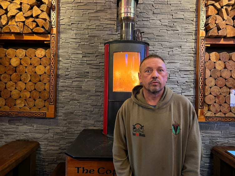 Carl Underwood inside Coffee Cottage