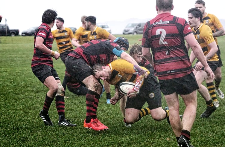 Ramsey’s Kyle Kenyon tackles Vagabonds’ Paul Howard during the two sides' rare goalless draw at Mooragh Park on Saturday (Photo: John Liver/Mumbles Pics)