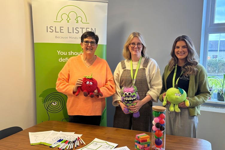 Sarah Kelly from the Manx Lottery Trust, pictured with Becks Macnair and Holly Ramsay of Isle Listen’s education team