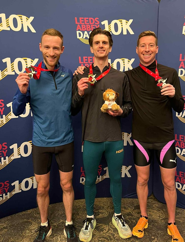 Isle of Man athlete Ollie Lockley (left) with his bronze medal after finishing third in the Leeds Abbey Dash 10km road race last weekend