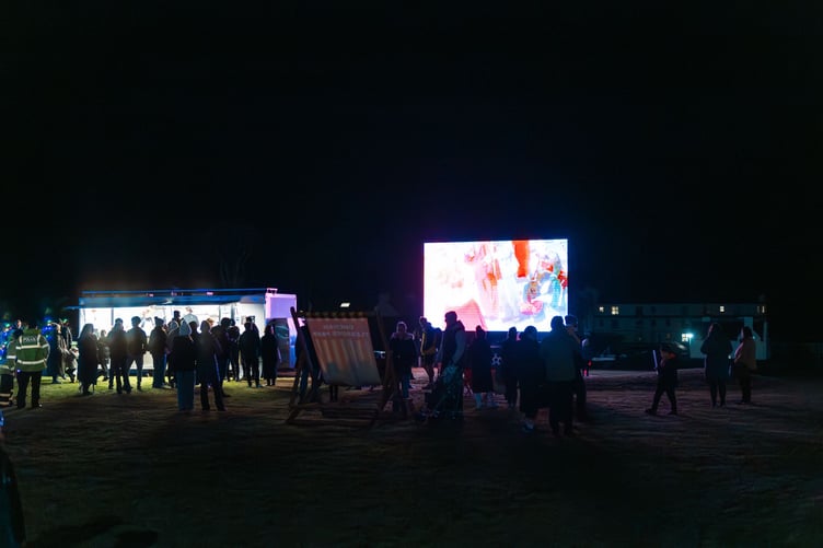 A big screen and deck chairs were there for people to enjoy