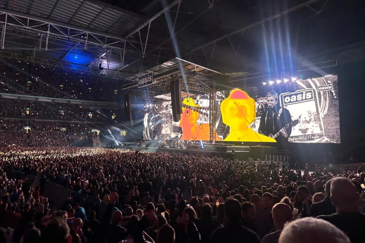 Oasis in concert during their stadium tour this summer