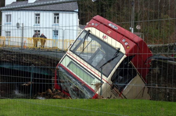The double decker stranded in the river afte the 2015 collapse of the old Laxey bridge