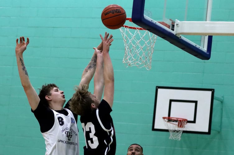 Jack Wilson makes a strong baseline post move for Cannons Elite against the defence of DGU Jets' Mattie Jennings (Photo: John Long)