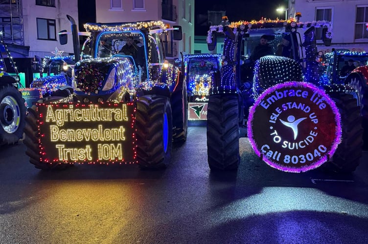The two front running tractors, Isle Stand Up to Suicide and the Isle of Man Agricultural Benevolent Trust