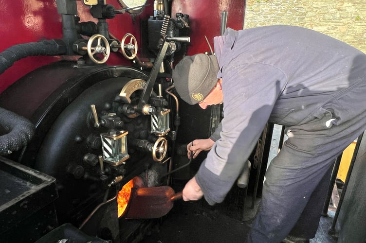 IoM Railway's James Maddrell adds another shovelful of coal to the firebox