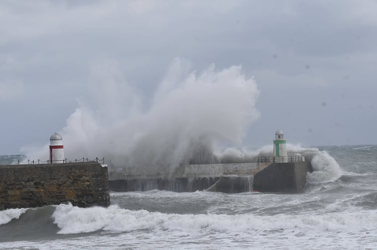 Previous waves breaking over Laxey Harbour during Storm Emma 