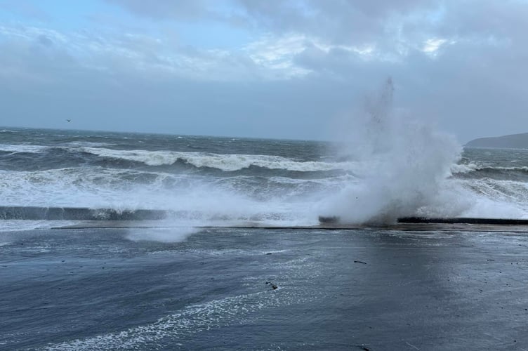Waves crashing over Laxey Promenade earlier today (Tuesday)