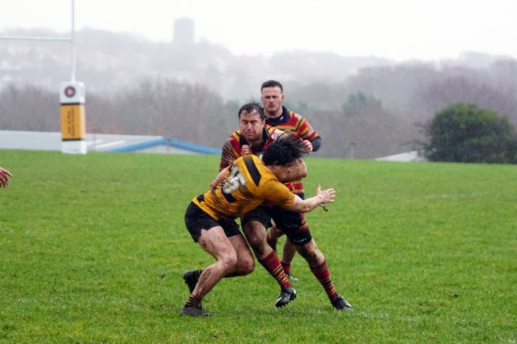 Vagabonds' fullback Max Ingrassia puts in a big hit against a Bury opponent during Saturday's match at a soggy Ballafletcher (Photo: John Liver/Mumbles Pics)