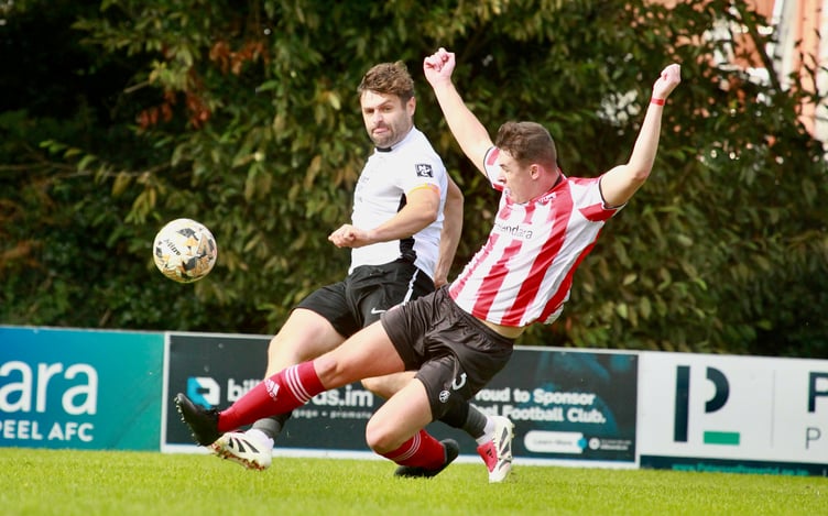 Peel's Sam Kennaugh attempts to block Corinthians' Josh Ridings' cross during the two sides' meeting at Douglas Road in September. The two teams face off again this weekend at Ballafletcher (Photo: Dave Norton)