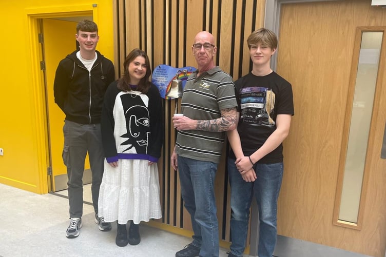 Dad and tonsil cancer survivor, Mark Newey, is urging people to support Stand Up To Cancer this December after he says a clinical trial funded by the campaign helped save his life. Pictured with his children (l-r) Travis, Zelda and Axel.