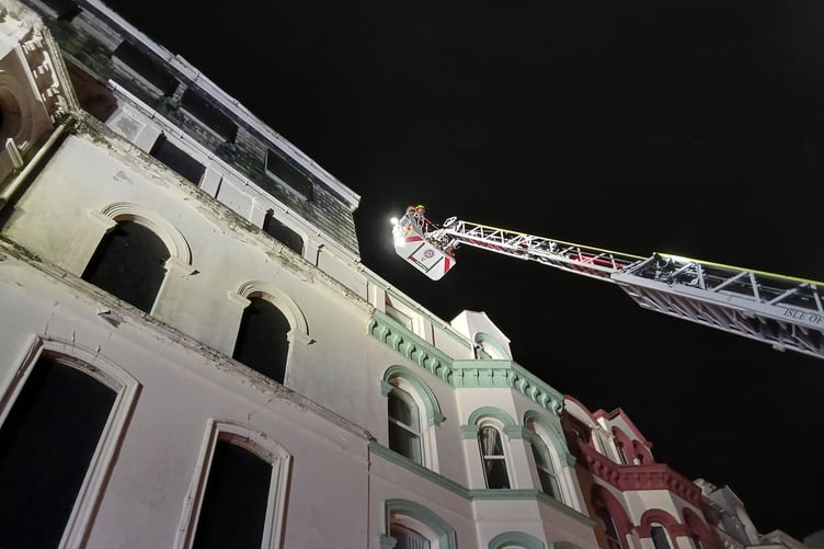 The Fire and Rescue Service removes debris from a hotel on Douglas Promenade
