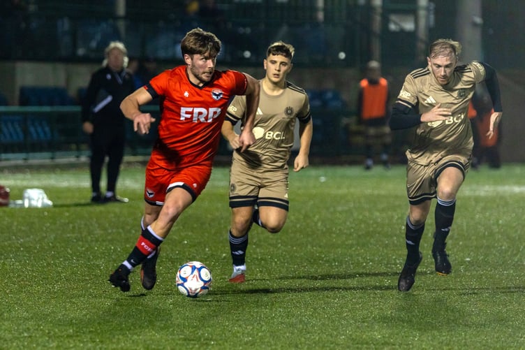 Shaun Kelly (left) goes on the attack for FC Isle of Man during Saturday evening's clash with AFC Liverpool at the Bowl (Photo: Hannah McHugh)