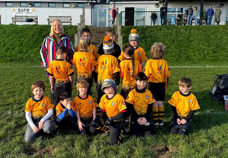 Vagabonds Rugby Club's new president Jo McCabe pictured with members of the Youth Vagas Minis team